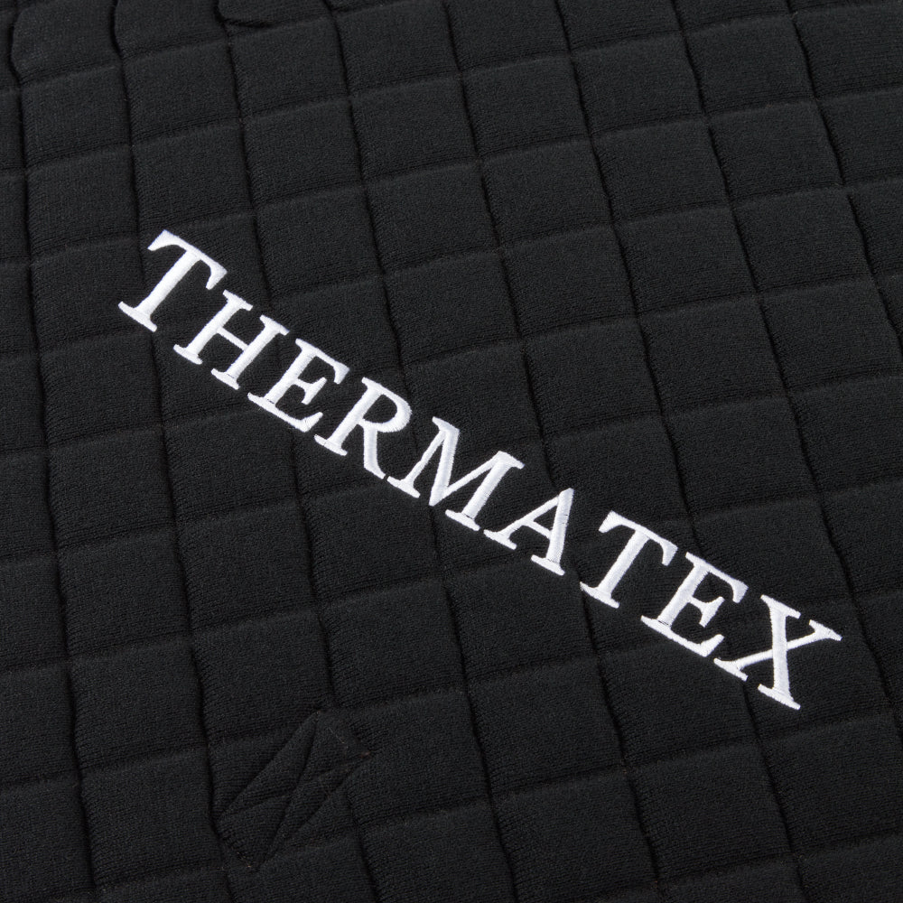 Thermatex Quarter Rug in Black with white binding, close-up of embroidery