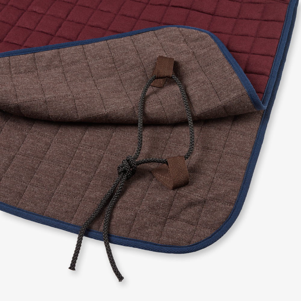 Thermatex Quarter Rug in Claret with navy binding, close-up of tail straps