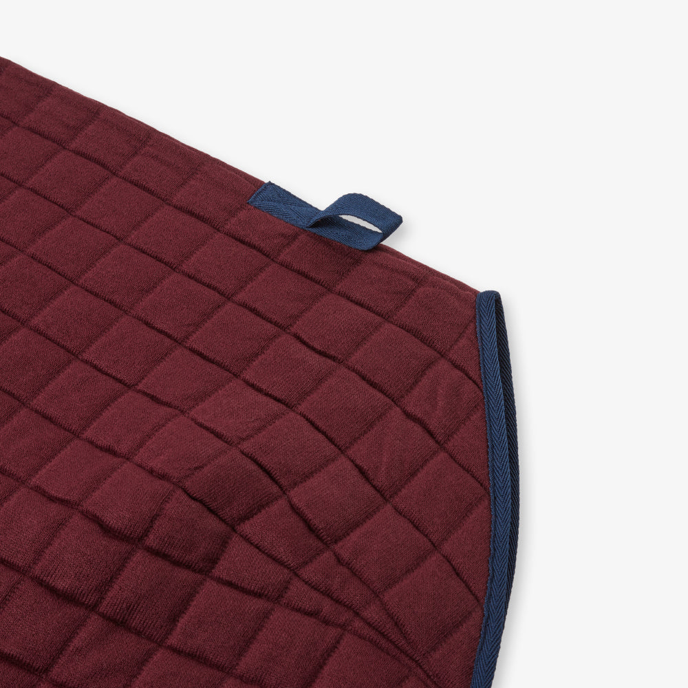 Thermatex Original Cooler Rug in Claret with navy binding, close-up of tail strap