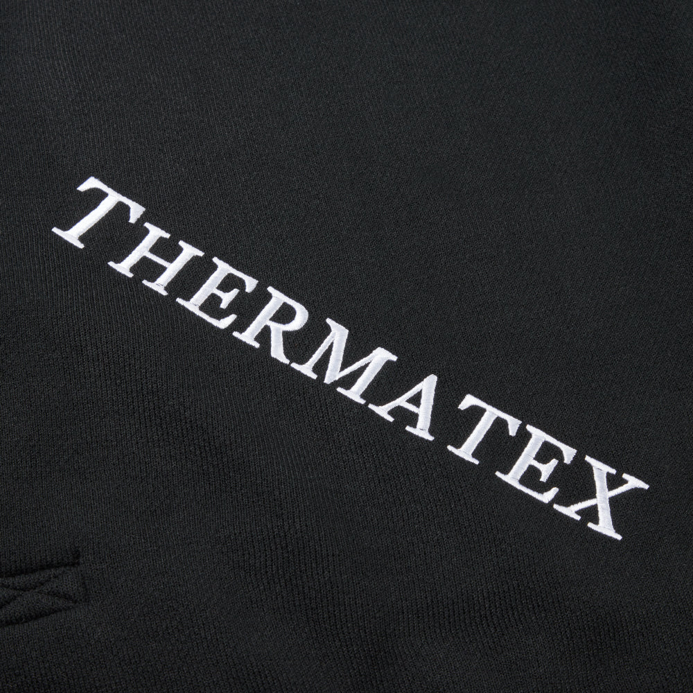Thermatex Lightweight Cooler Rug in Black with white binding, close-up of embroidery